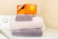 A box of Bounce dryer sheets is placed on clean folded towels - side angle view Royalty Free Stock Photo