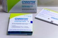 A box of Chantix medication with guides and warnings on a counter. Smoking cessation with modern medicine
