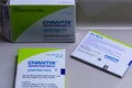 A box of Chantix medication with guides and warnings on a counter. Smoking cessation with modern medicine