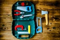 Box with children tools on wooden background Royalty Free Stock Photo