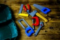 Box and children tools on wooden background