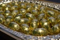 Box of chocolates in gold foil
