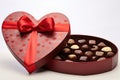 Box of chocolates in the shape of a heart with a red ribbon, A chocolate brown Valentine\'s Day gift box with a gold