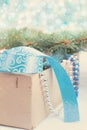 Box with Christmas toys, blue and silver beads, blue ribbon and Royalty Free Stock Photo