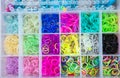 Box with colorful rubber bands for rainbow loom Royalty Free Stock Photo