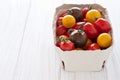 Box with colorful tomatoes Royalty Free Stock Photo