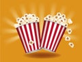 Box container with delicious popcorn, orange background