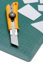 Box Cutter Knife just Cutting white paper Royalty Free Stock Photo