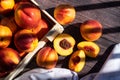 A box of delicious fresh peaches on the table. Peaches in an old rustic box on a dark wooden table. Royalty Free Stock Photo