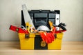 Box with different carpenter`s tools on table Royalty Free Stock Photo