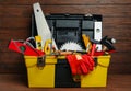 Box with different carpenter`s tools on wooden table Royalty Free Stock Photo