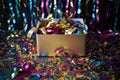 box filled with metallic confetti and streamers