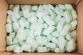 Box filled with polystyrene foam peanuts packaging filler cushioning material Royalty Free Stock Photo