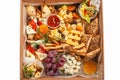 A box of food, cheese, breads, fish, shrimp. Food delivery for the company, romantic, office dinner at home. Beautiful composition Royalty Free Stock Photo