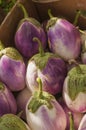 A box full of beautiful white and purple Bianca eggplants