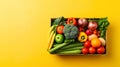 Box full of food in concept delivery and donation box. Cardboard box full of colorful fresh vegetables, fruits