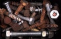 Box full of old bolts, different condition and size Royalty Free Stock Photo