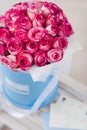 Box full of pink roses with greeting-card