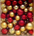 Box full of red and gold Christmas tree ornament balls Royalty Free Stock Photo