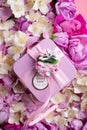 Box with gift  around roses  and  jasmine background. romantic and beauty concept Royalty Free Stock Photo