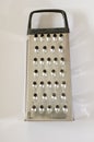 Box grater shiny silver well used kitchen utensil Royalty Free Stock Photo