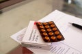 A box of hyroxychloroquine tablets on a prescription paper