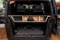 A box made of wood and sawn holes with black leather for the installation of subwoofers and speakers for an audio system with a Royalty Free Stock Photo