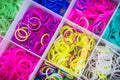 Box with many colorful rubber bands for rainbow loom Royalty Free Stock Photo