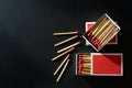 Box matches stick in red paper box on black background. Royalty Free Stock Photo