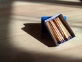 a box of matches on a wooden table Royalty Free Stock Photo