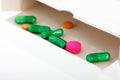 Box with medicine in green, pink and yellow Royalty Free Stock Photo