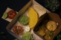 Box mexican food, Tacos, lettuce, sour cream, guacamole, nachos, cheddar cheese