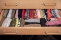 box with neatly folded t-shirts taking advantage of the space