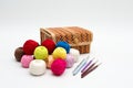 A box for needlework, colorful reels of thread and a set of hooks for home knitting. Still life on a white background Royalty Free Stock Photo