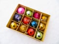 Box with old christmas balls in the snow Royalty Free Stock Photo