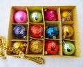 Box with old christmas balls in the snow Royalty Free Stock Photo
