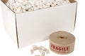 Box of packing peanuts with roll of fragile tape