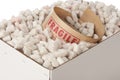 Box of packing peanuts with roll of fragile tape