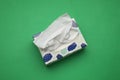 Box of paper tissues on green background, top view Royalty Free Stock Photo