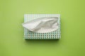 Box of paper tissues on light green background, top view Royalty Free Stock Photo