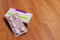 A box of pills. A plate of pills. Packing with tablets Royalty Free Stock Photo