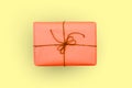 Box of red on a yellow background. Gift or package