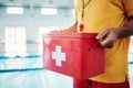 Box, safety or hands of a lifeguard by a swimming pool helping rescue the public from water danger or drowning. Zoom