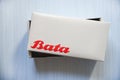 Box shoe Bata logo banner and red wording