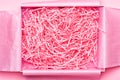 Box with shredded pink paper packing material Royalty Free Stock Photo