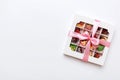 Box with sweet chocolate candies on color background, Various candy sweets. Valentines day gift box. Top view flat lay Royalty Free Stock Photo