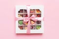 Box with sweet chocolate candies on color background, Various candy sweets. Valentines day gift box. Top view flat lay Royalty Free Stock Photo