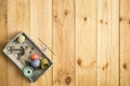 Box of tailor, scissor, tape measure and sewing threads with colorful bobbins for patchwork on wooden background