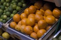 Box of tangerines and limes Royalty Free Stock Photo