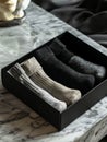 A box of three pairs of socks on a marble table Royalty Free Stock Photo